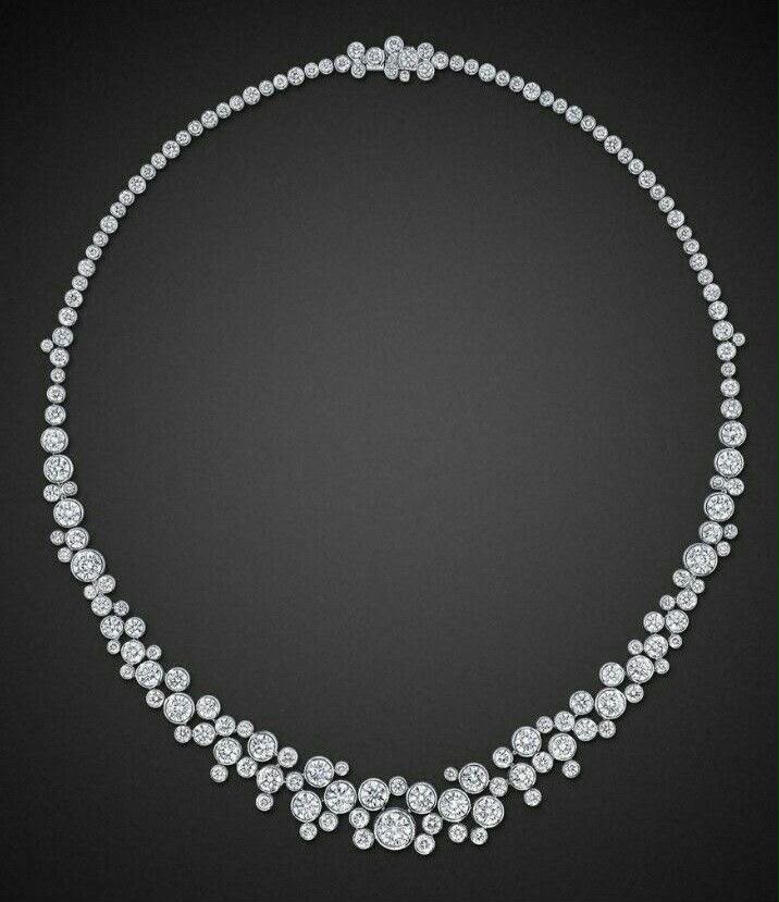 A rounded necklace with pale petal-shaped details along the lower edge.