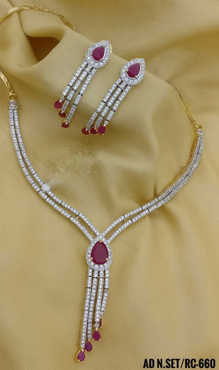 a pendant necklace with matching earrings