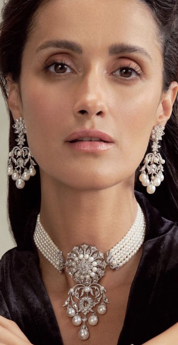 a close necklace design shown with matching earrings