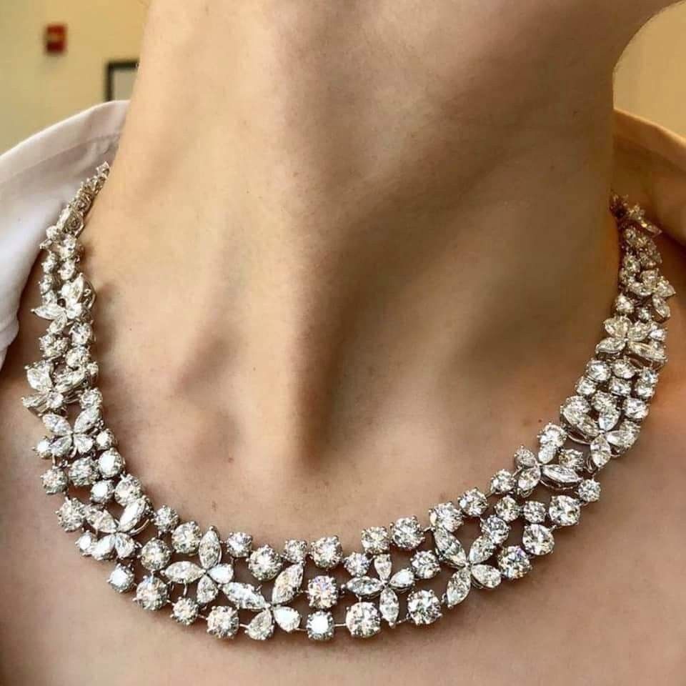 a curved necklace with layered bright details