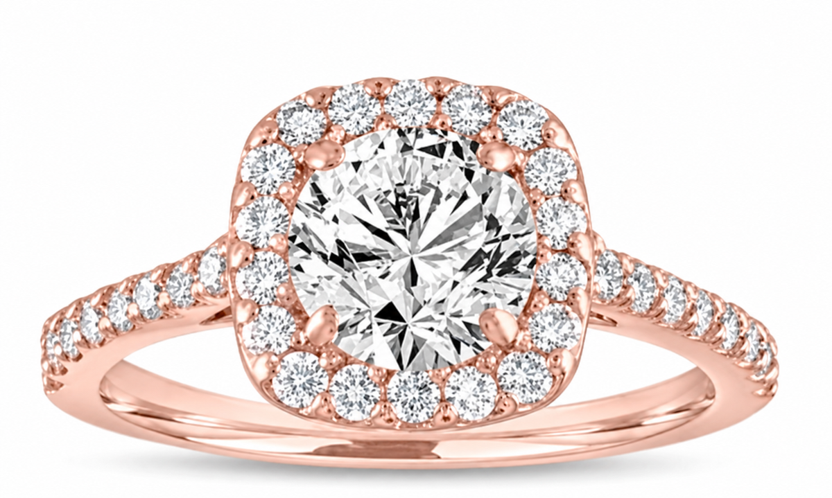 A round clear centre sits within a softly squared halo and slender sparkling shoulders.