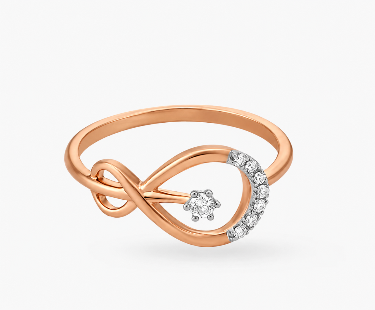 A rose-coloured infinity loop curves into a sparkling teardrop outline with a suspended clear accent.
