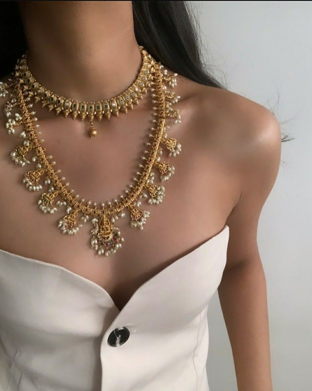 a multi-row necklace with coordinated ornament details
