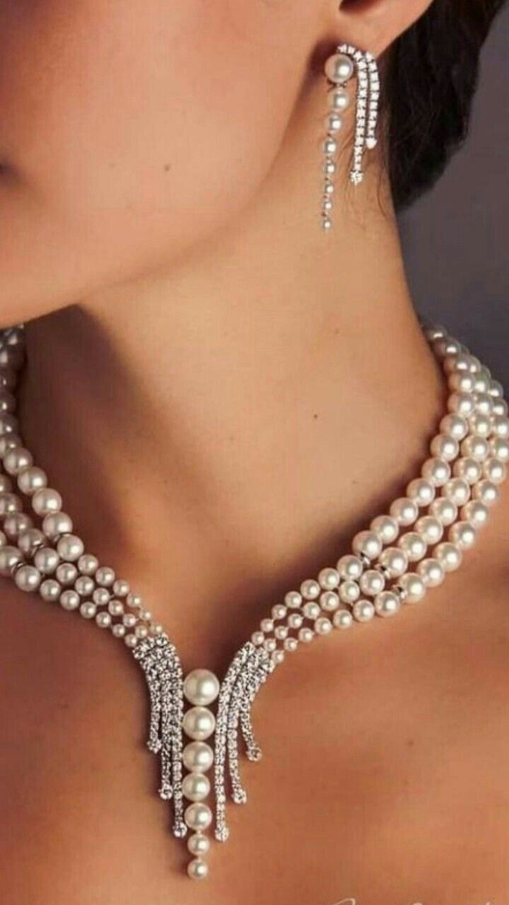 a necklace and matching earrings shown together