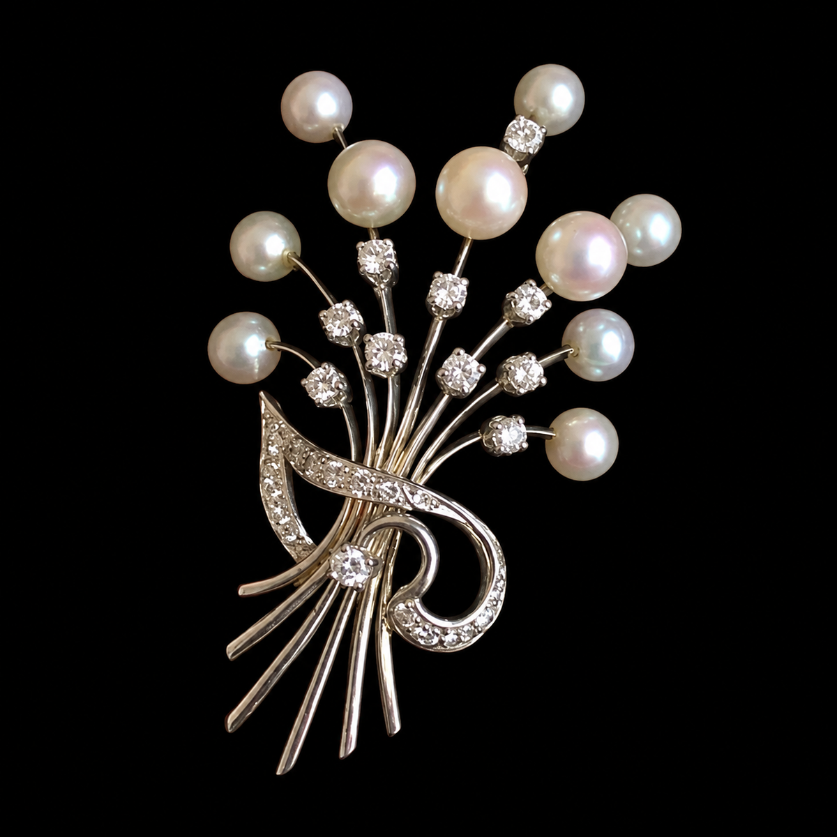 Lustrous pale beads rise on slender stems gathered by a sparkling curled ribbon.