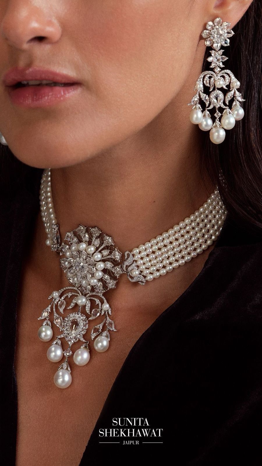 a necklace and matching earrings shown together