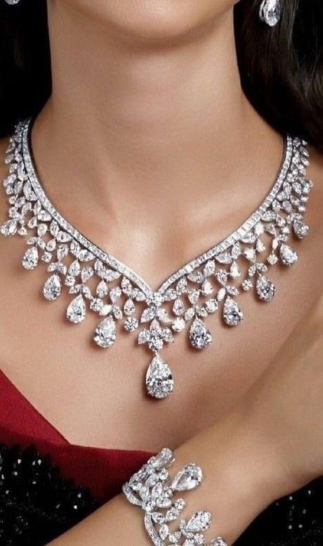 a necklace with matching earrings shown together