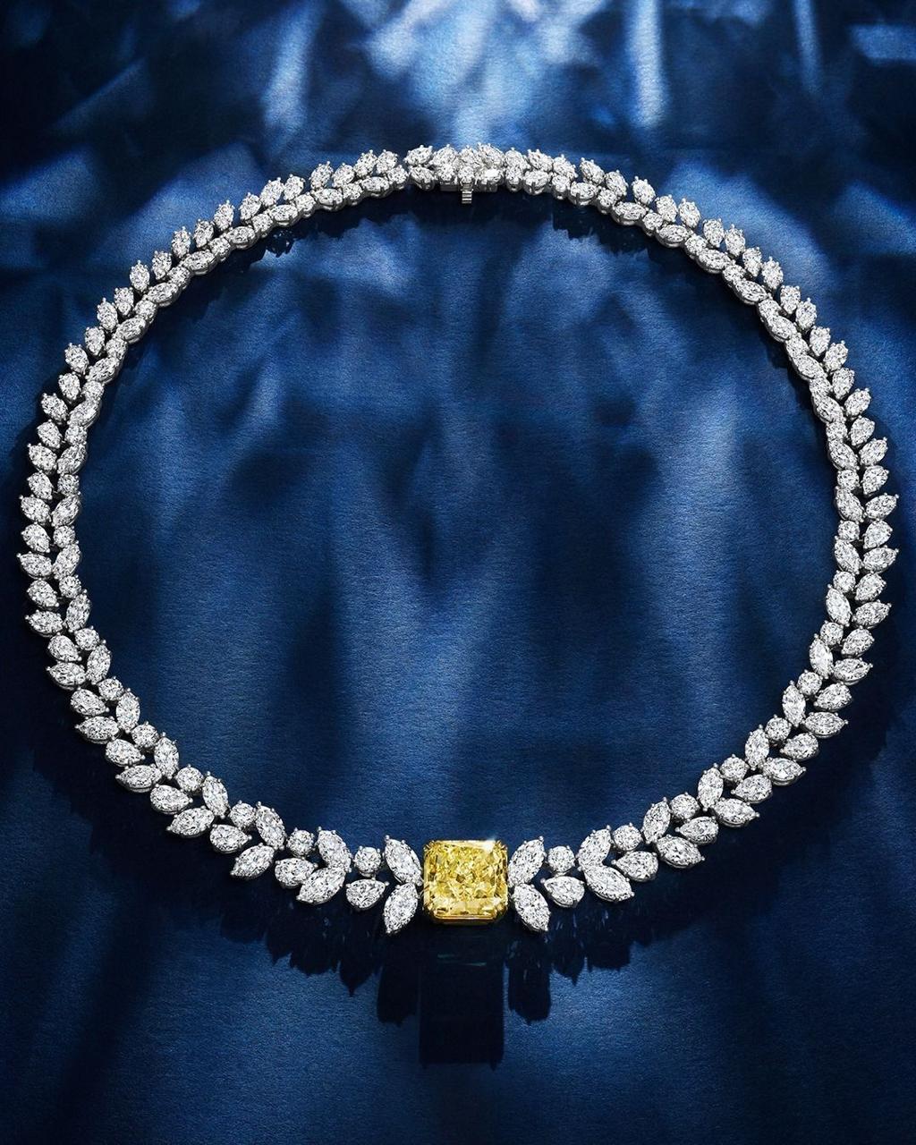 a close curved collar with a small square center detail