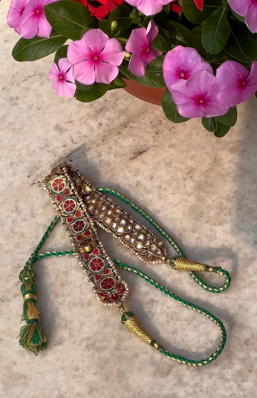 a long necklace with a prominent central hanging detail