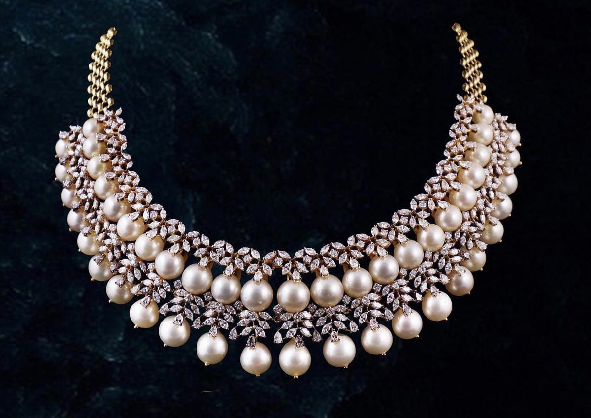necklaces with a crescent-shaped arrangement of pale rounded accents
