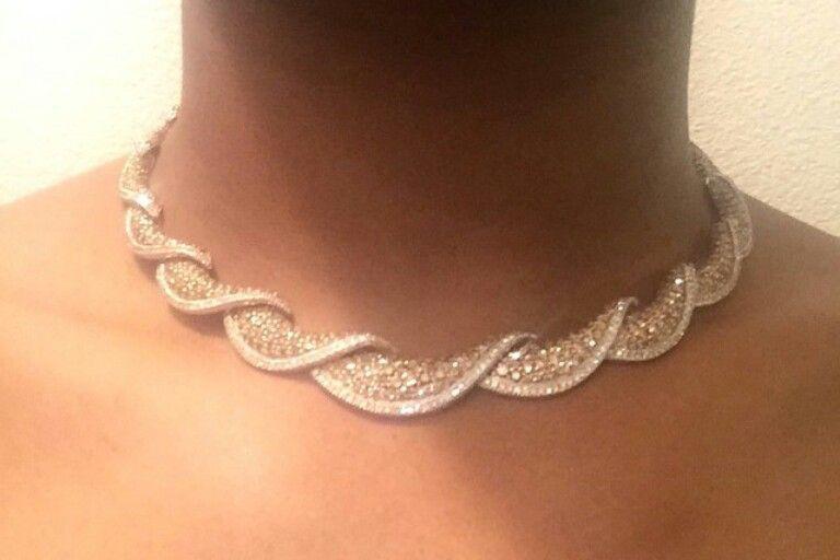a necklace with a repeating curved link pattern