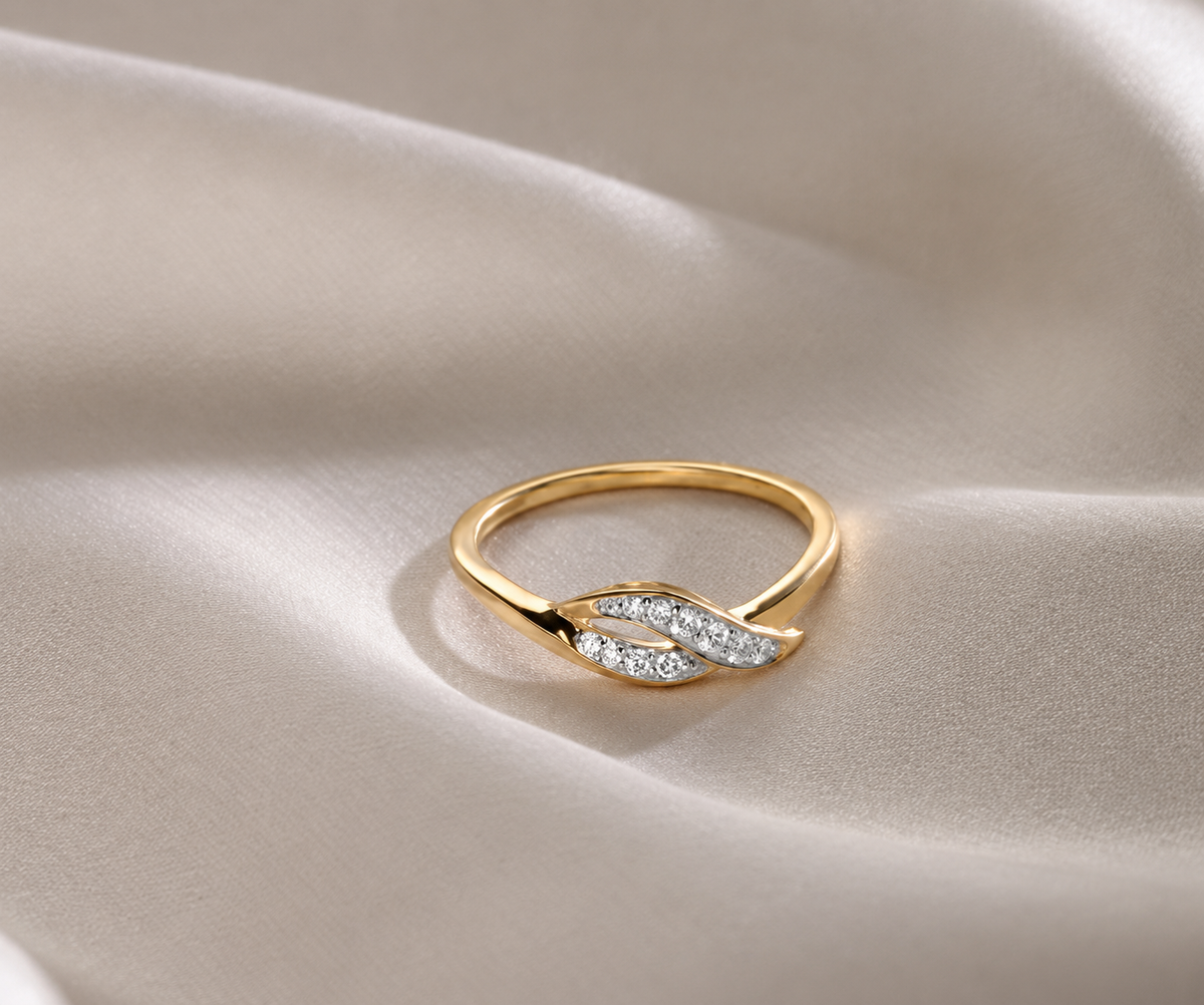 A tapered leaf-like row of clear accents meets a polished yellow-coloured curve in a gentle twist.
