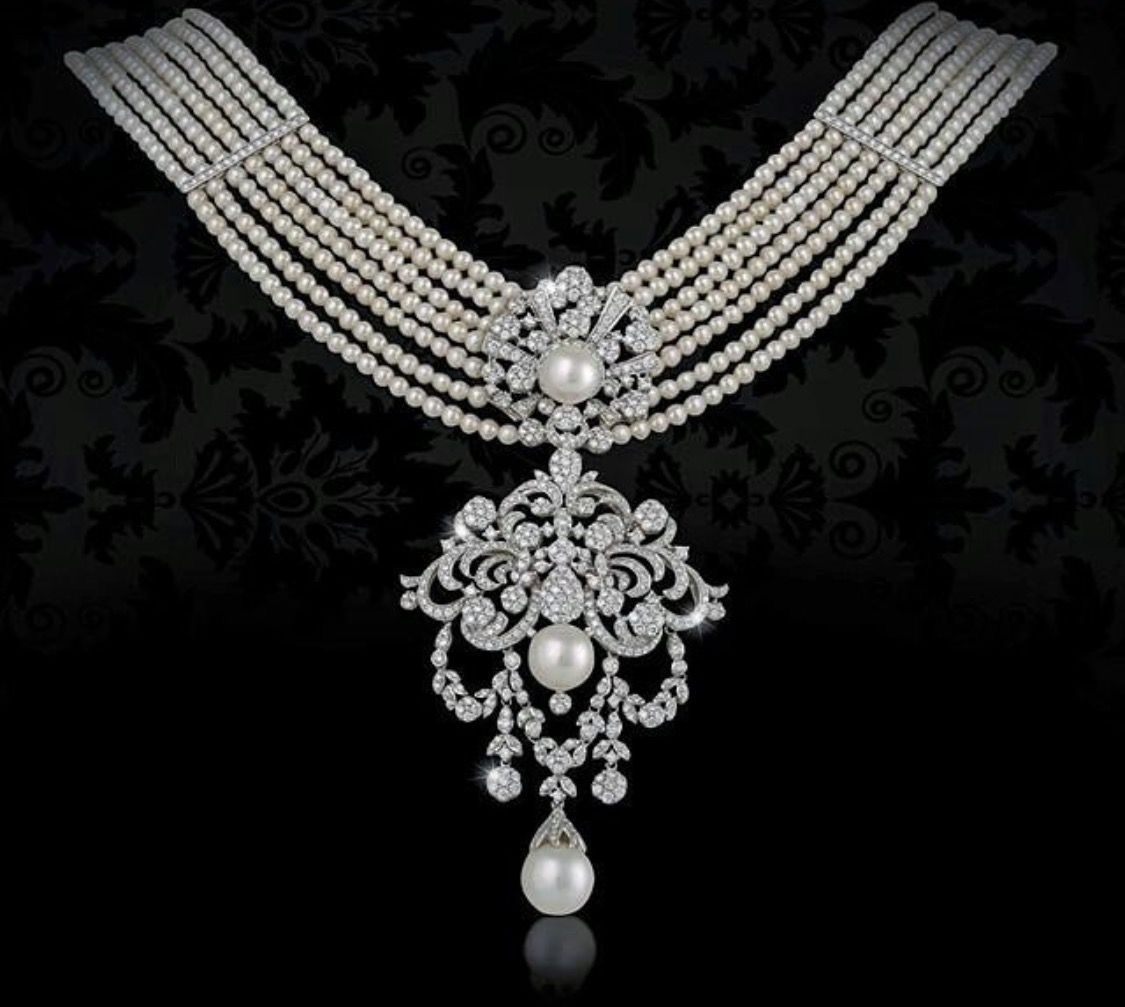 Necklace featuring a wide beaded collar with a long central drop