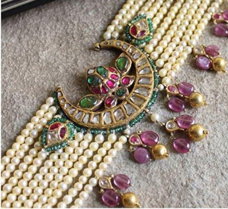 a layered strand with a decorative central medallion