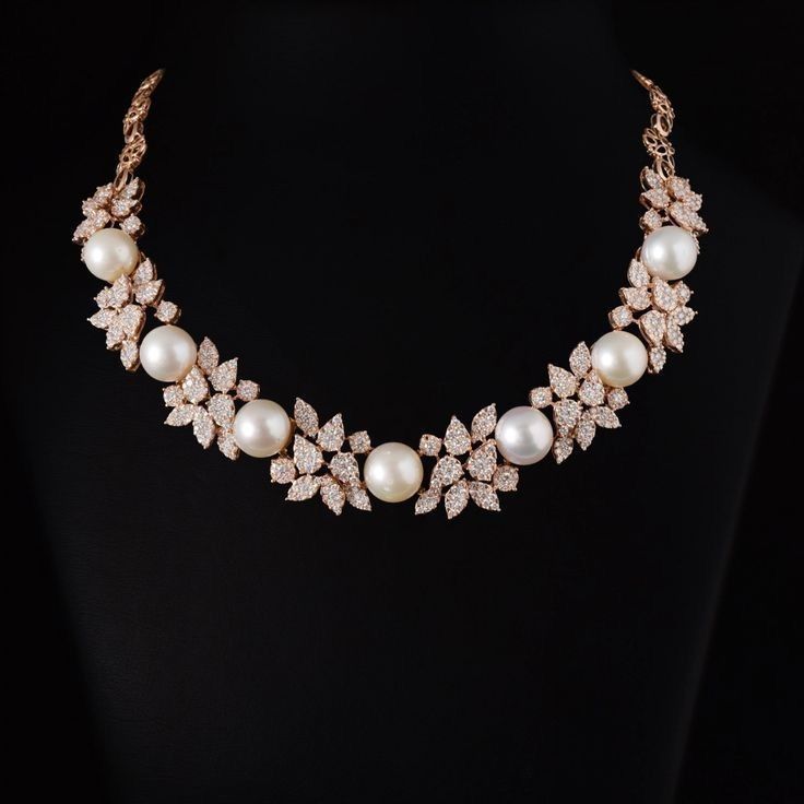 a pale floral arrangement with a centered hanging detail