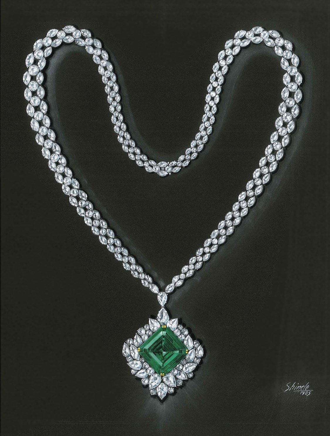A necklace with a green-toned diamond-shaped pendant framed by pale details.