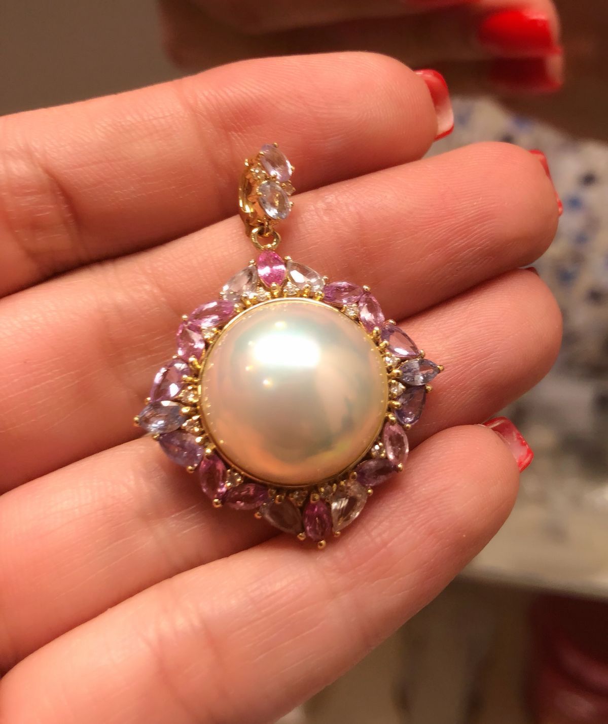 A large pale round center is surrounded by a scalloped floral frame.