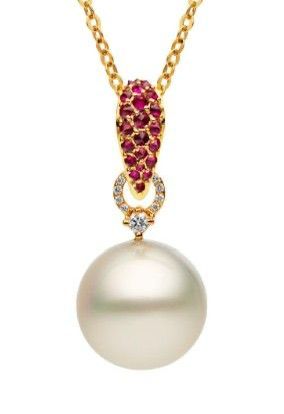 A fine necklace with a pale round pendant beneath a pink-toned detail.