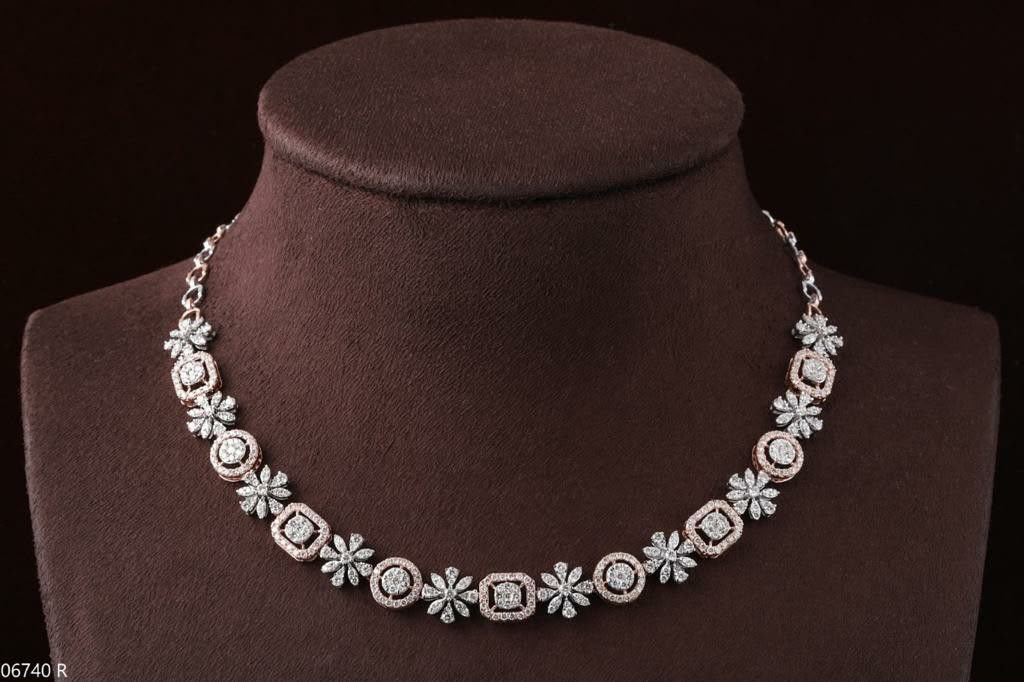 A short necklace with repeating pale flower-shaped links.