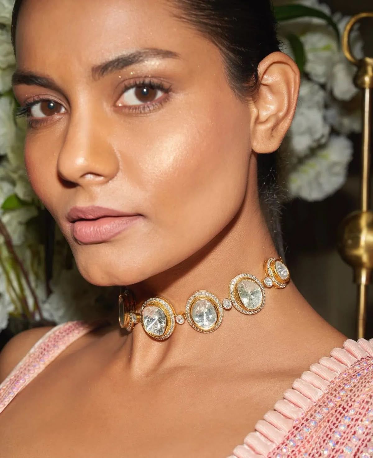 a broad collar with a round centerpiece