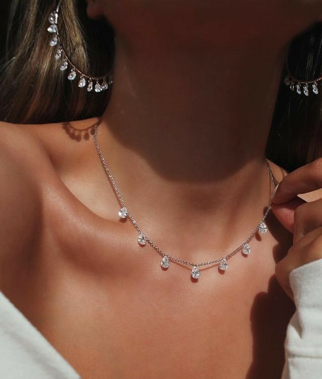 a delicate chain with small round accents spaced along it