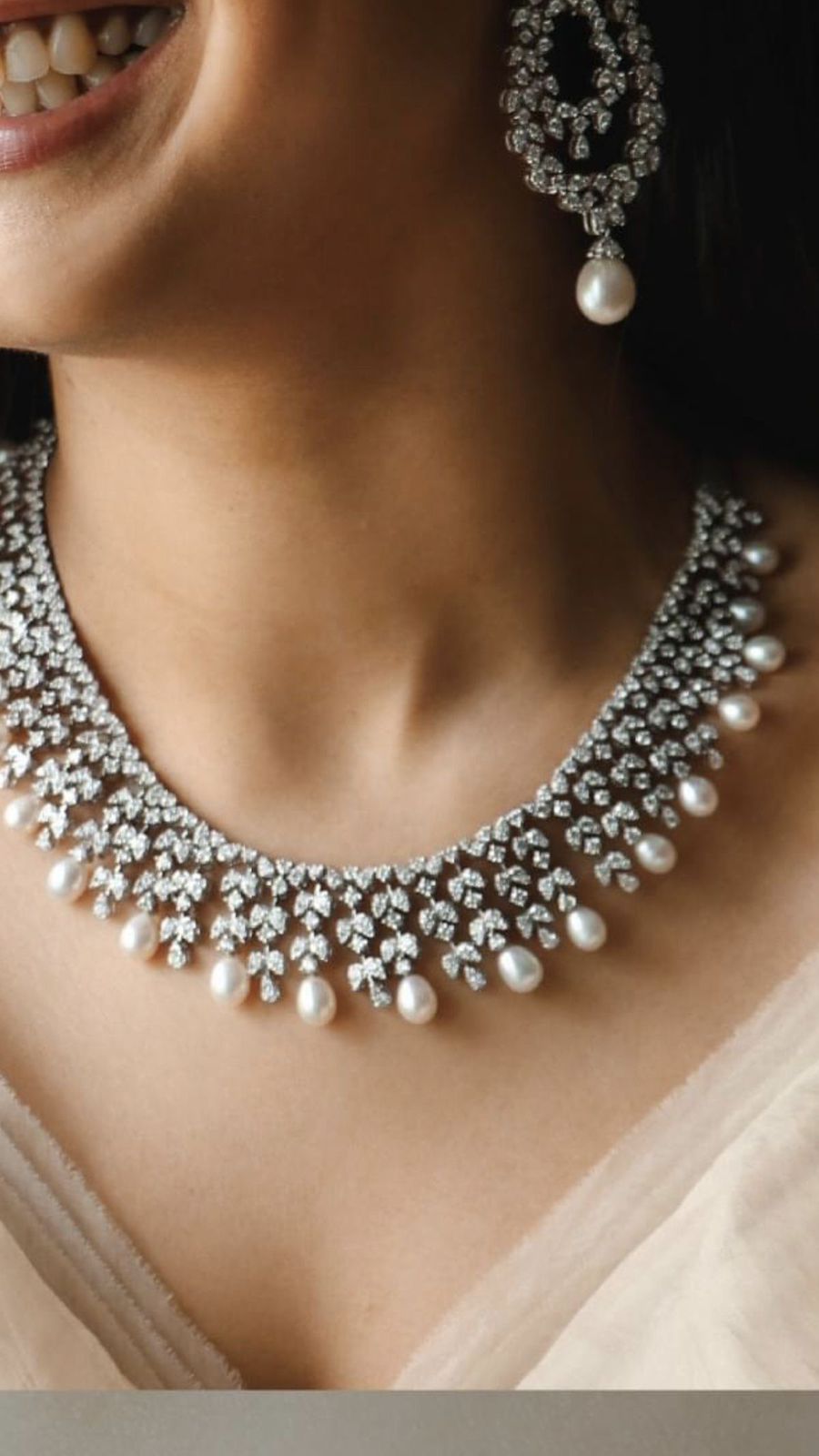 necklaces with a dense arrangement of bright accents with hanging details