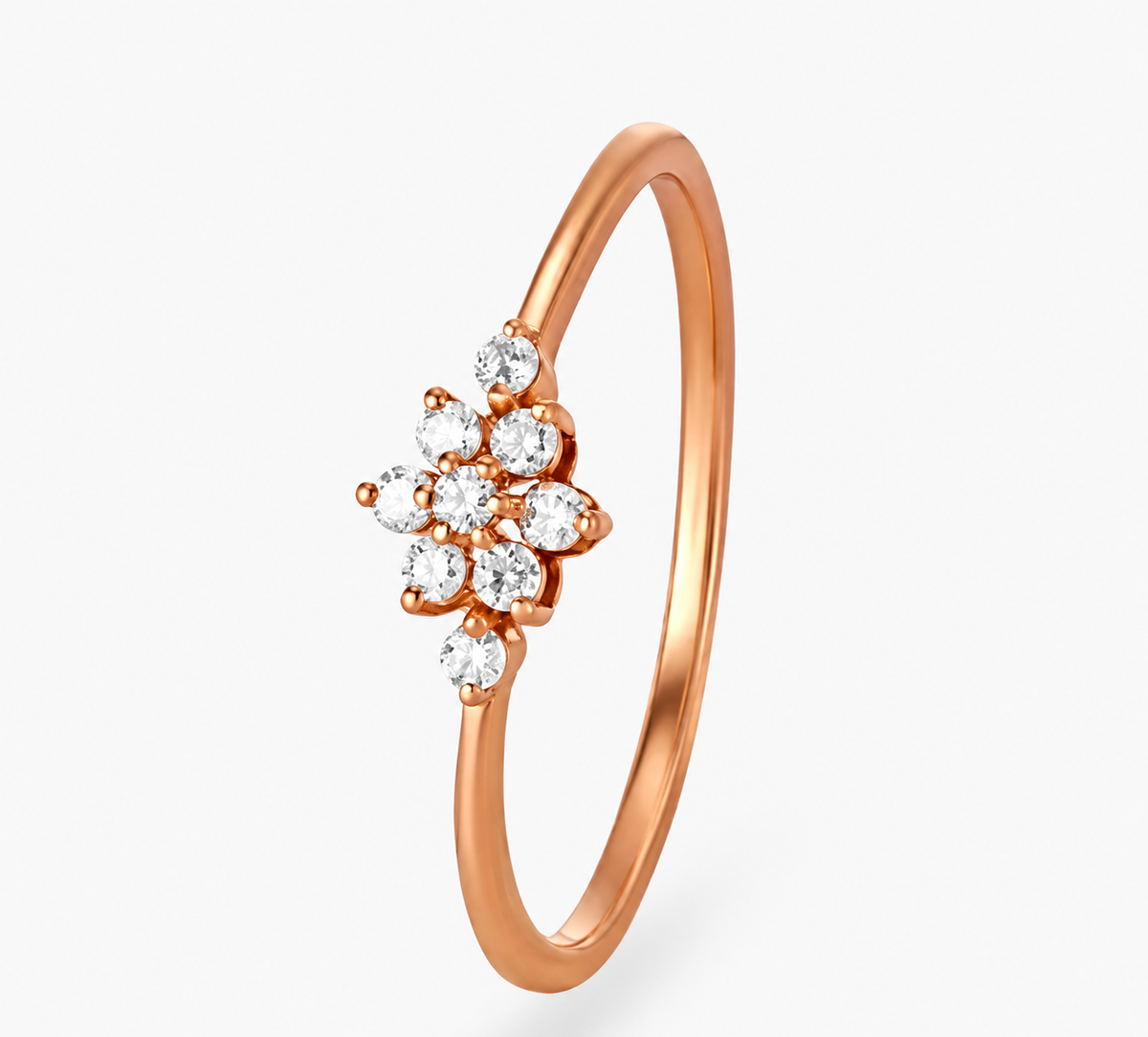 A petite flower-like cluster of clear accents decorates a fine rose-coloured band.