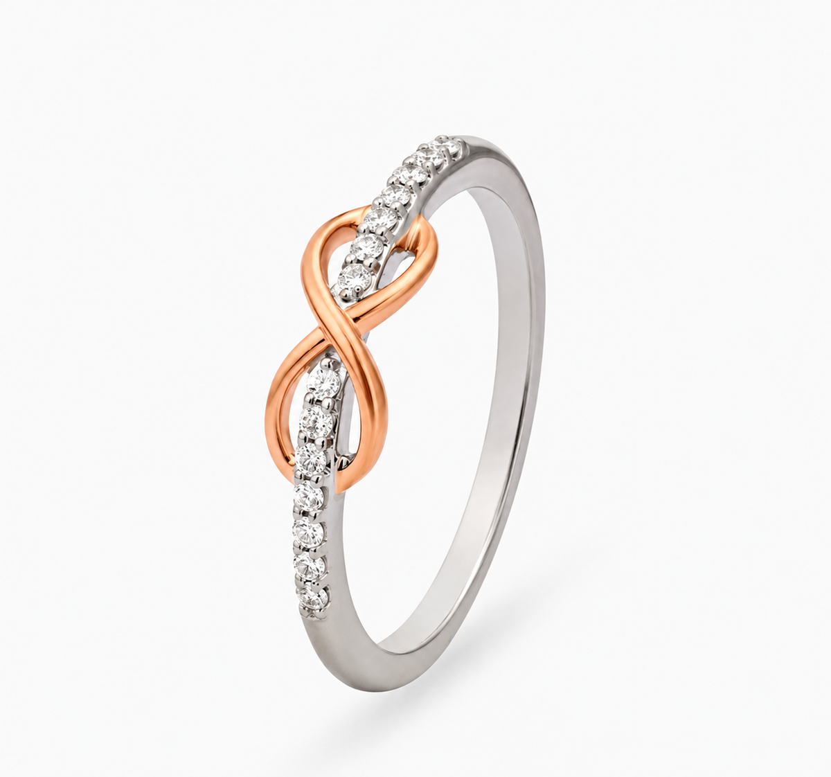 A rose-coloured infinity motif wraps around a slender band lined with clear accents.