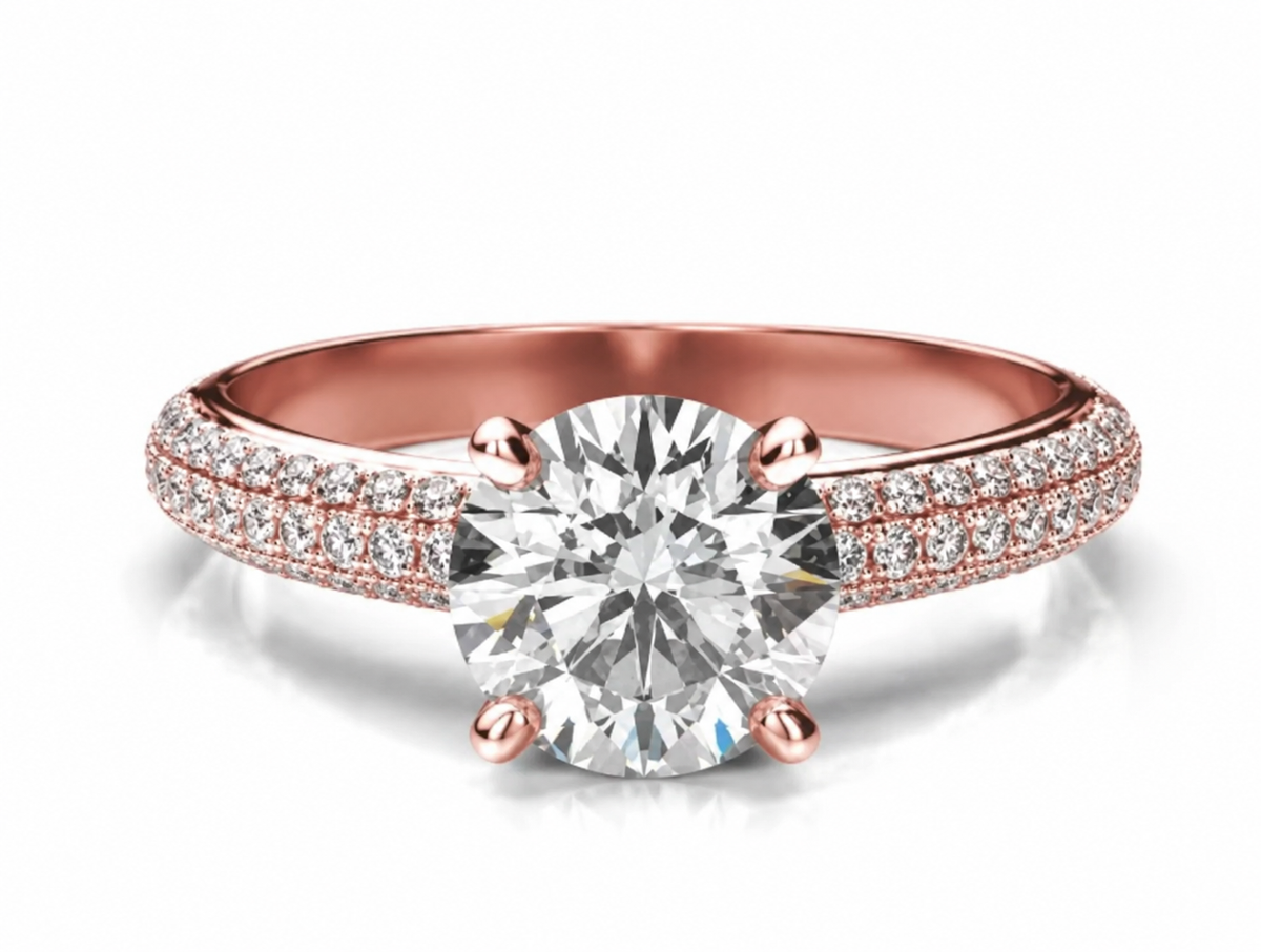 A round centre rises above a broad rose-coloured band with layered rows of clear accents.