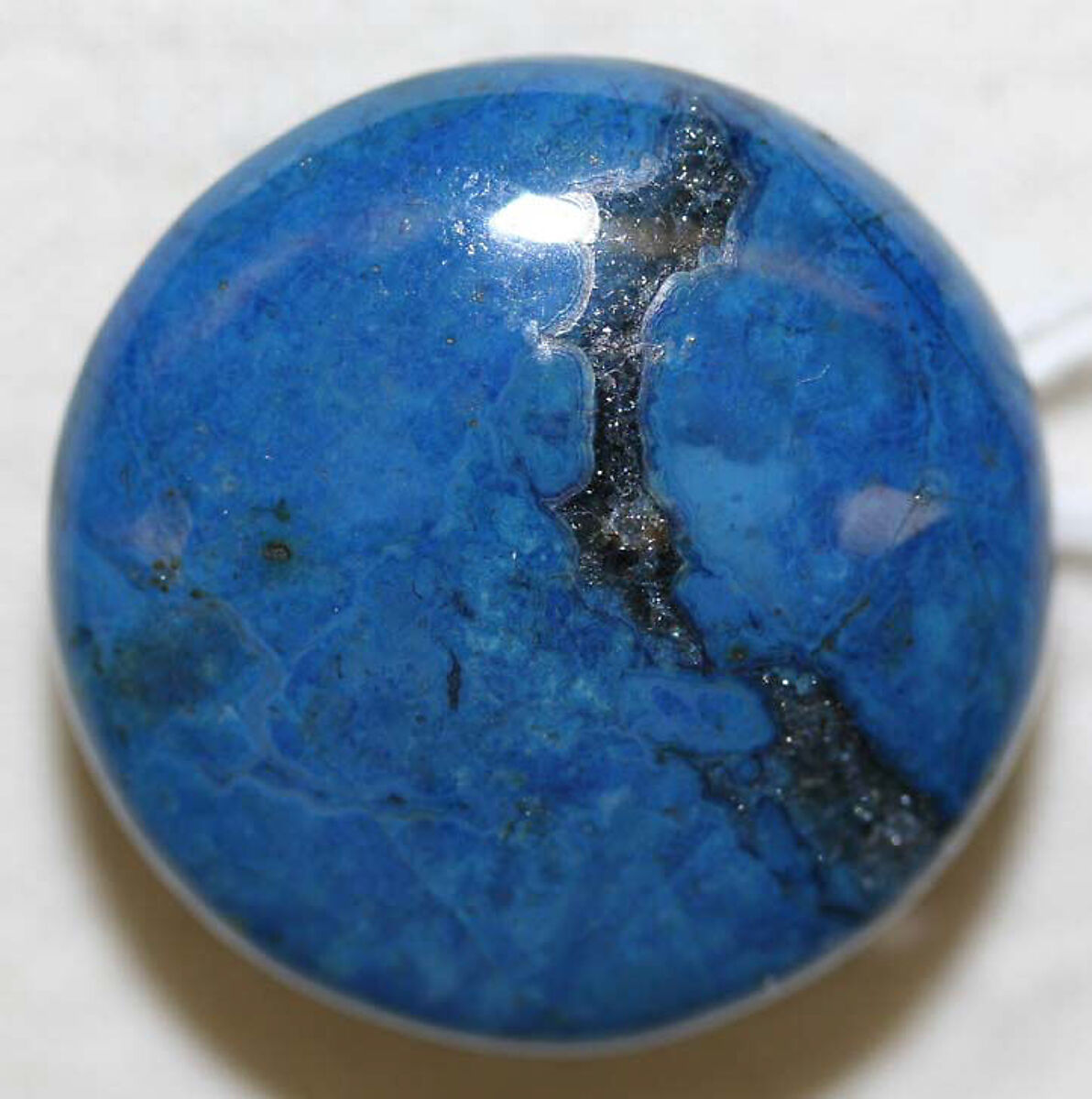 Historical round lapis lazuli cufflink with deep blue natural markings