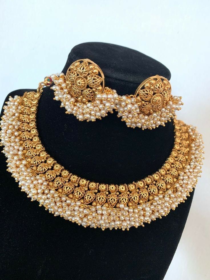 a necklace with matching earrings shown together