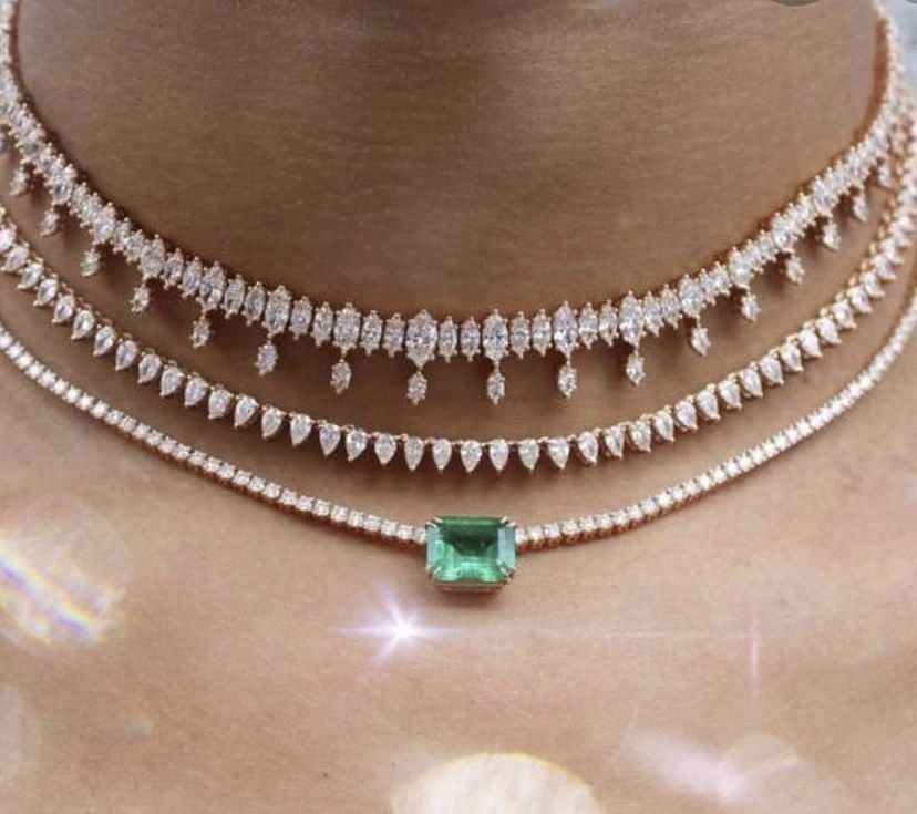a rectangular green-toned center on a fine necklace chain