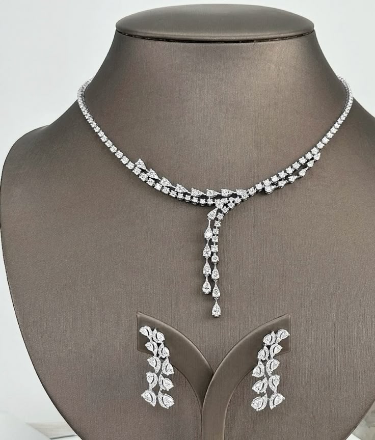 a necklace with matching earrings shown together
