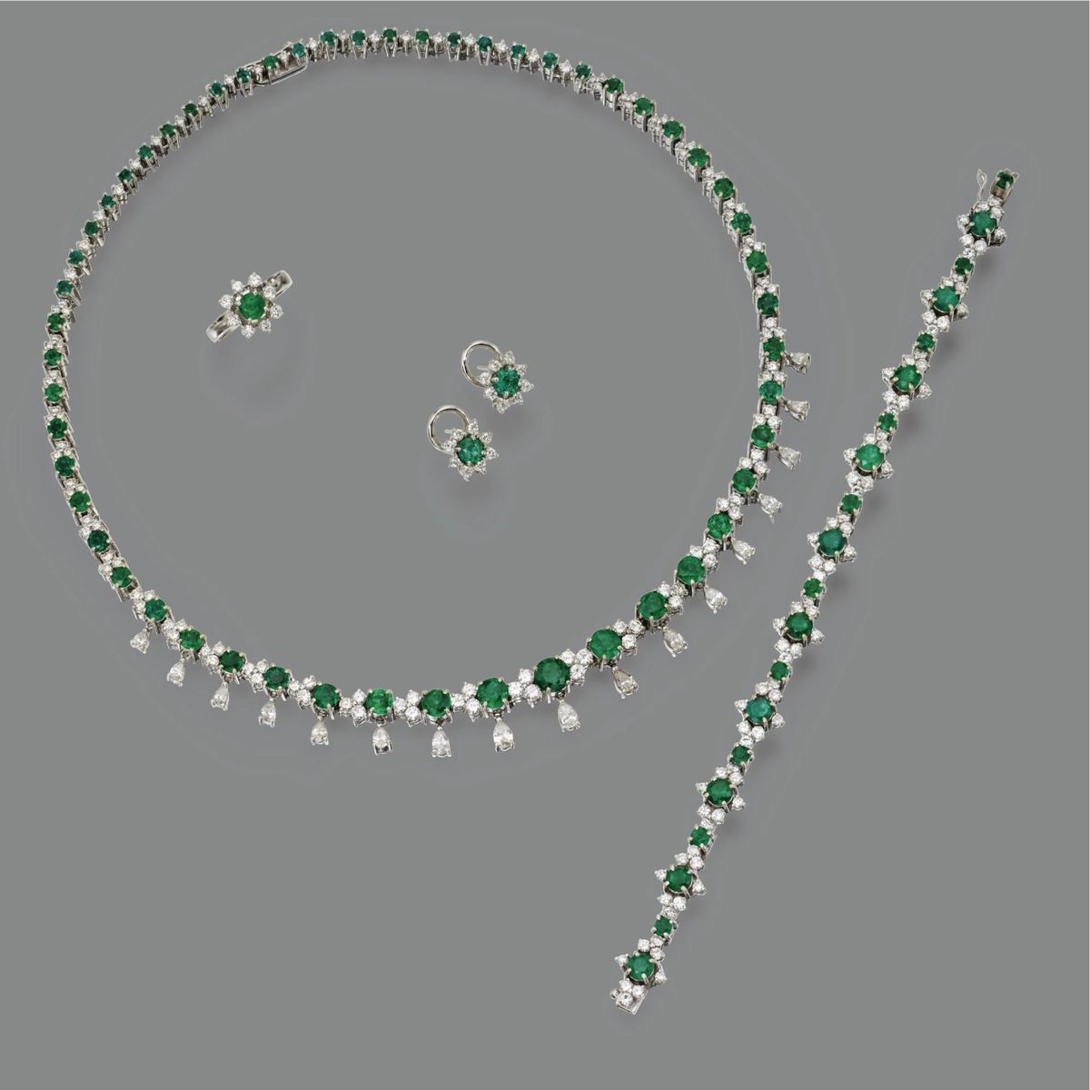 a necklace shown with matching earrings and coordinating details