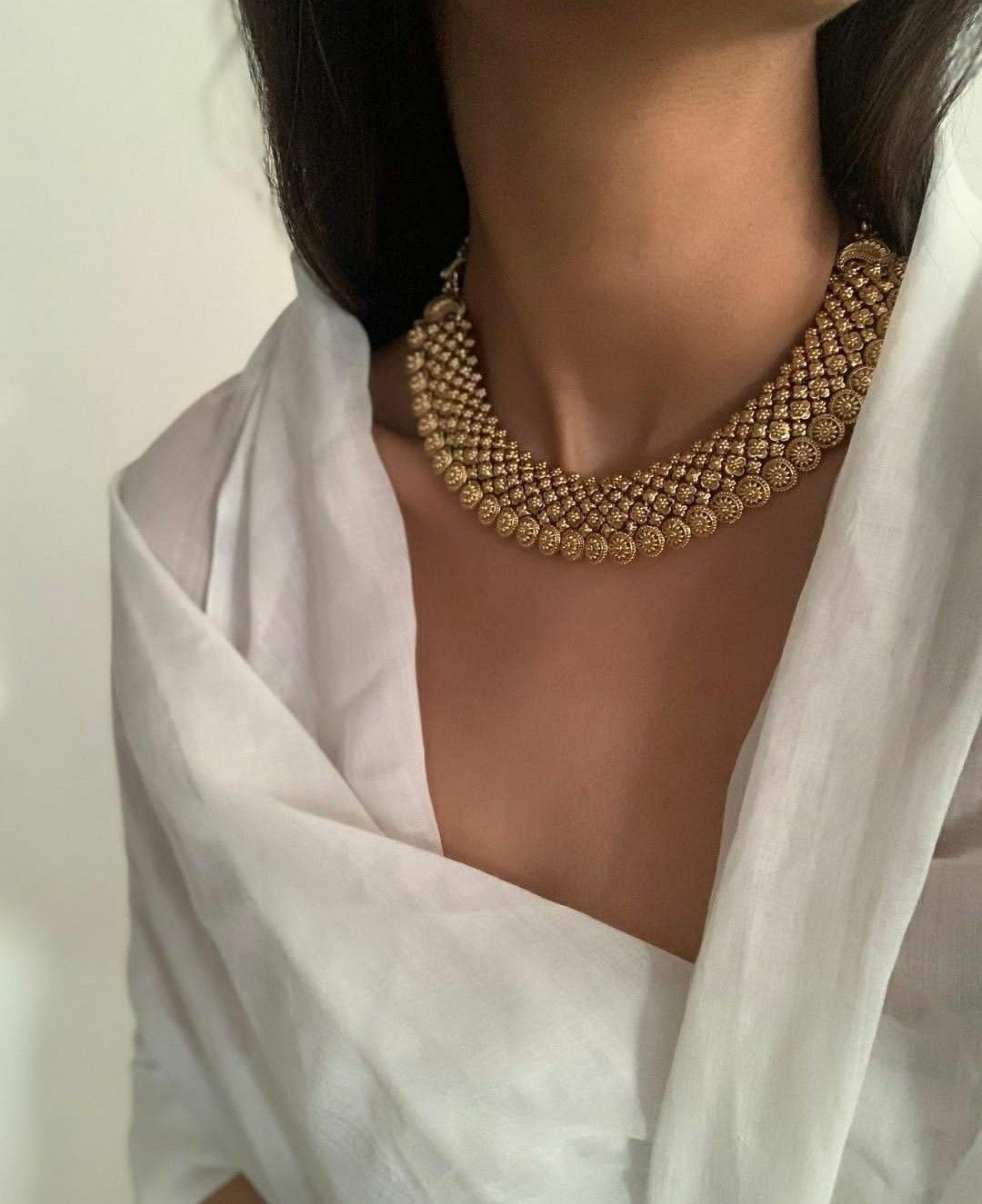 a close necklace with repeated small bead details