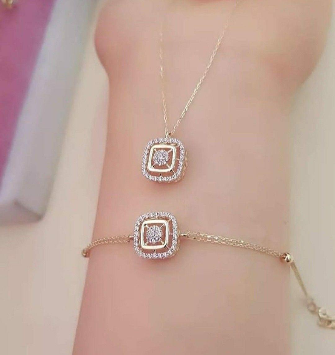 a bracelet with a rectangular center detail, shown with a ring