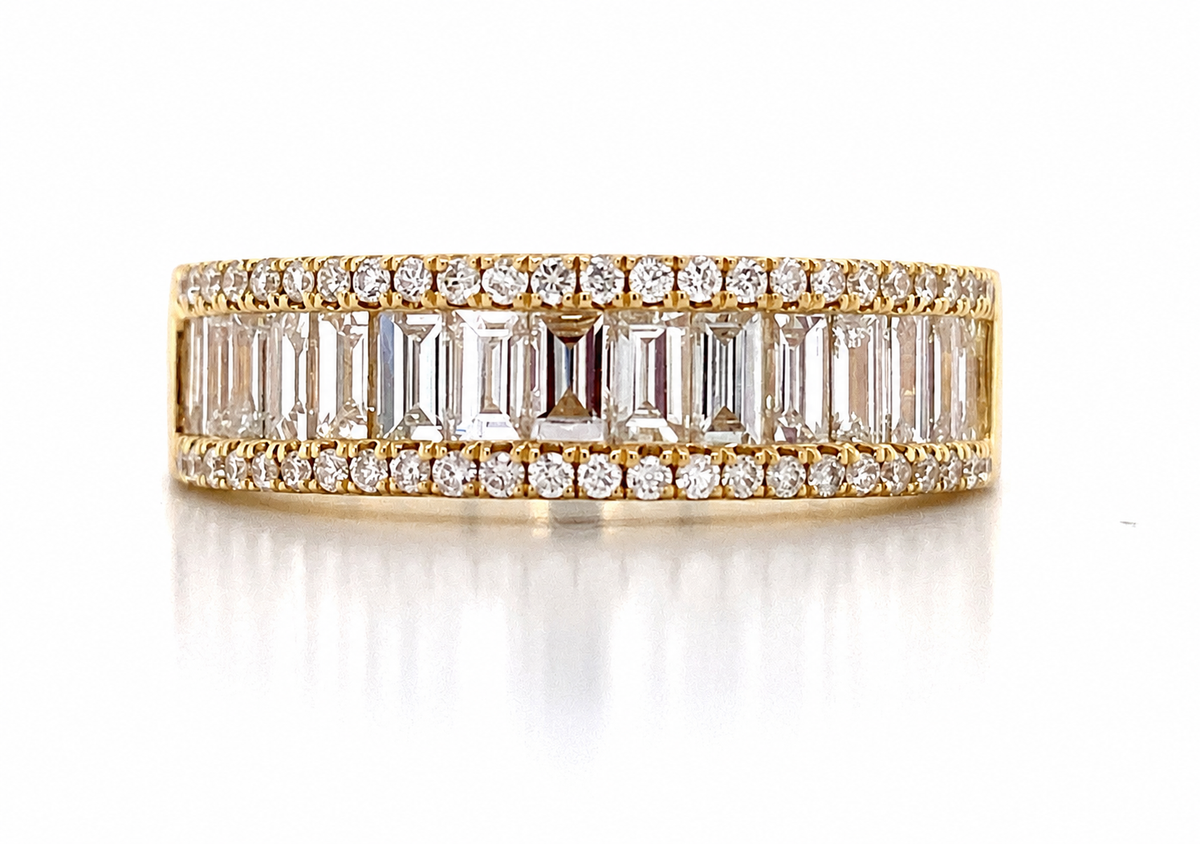 A broad yellow-coloured band displays rectangular clear stones between two rows of round accents.