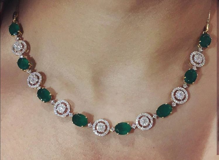 green-toned round details repeated along the chain