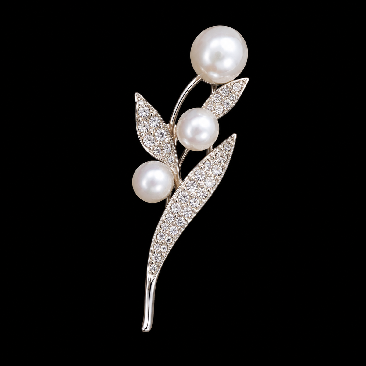 Three pale round beads punctuate a slender sprig of sparkling pointed leaves.