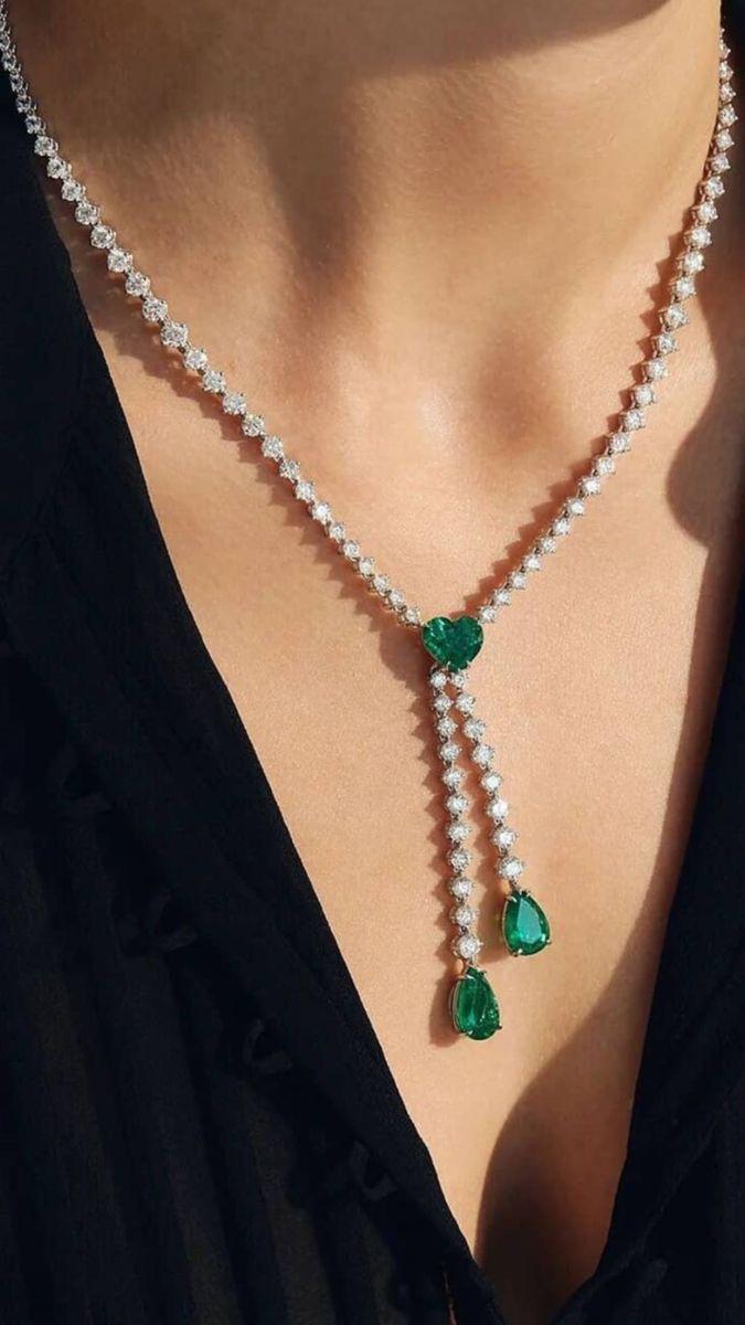 a fine chain with a long green-toned center drop