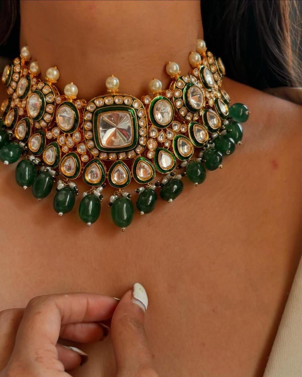 a layered collar with green-toned center details