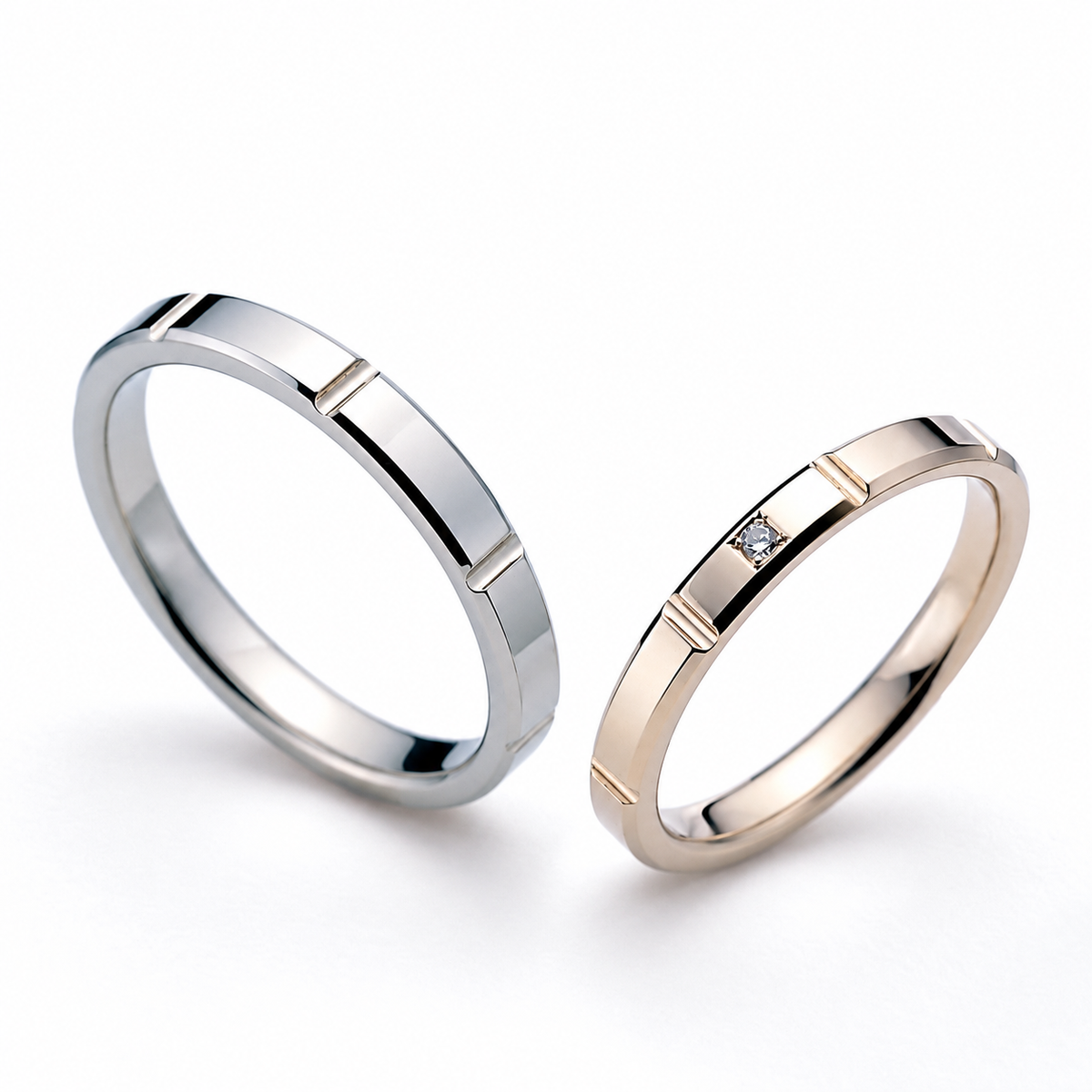 Two polished bands with contrasting tones share clean linear details, with a small clear accent on one band.
