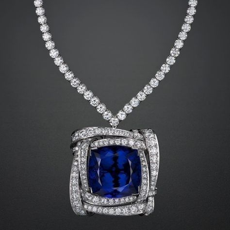 a rectangular blue-toned centerpiece on a fine chain