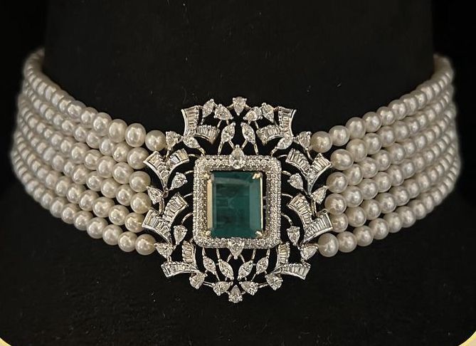 a wide band with a rectangular green-toned center