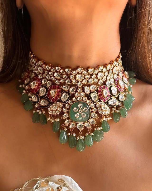 a broad arrangement with green-toned and pale hanging details