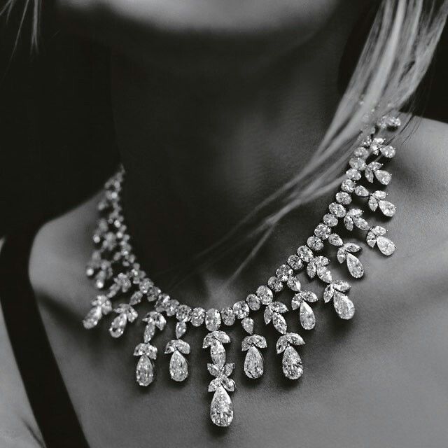 a necklace with repeated petal-like hanging details