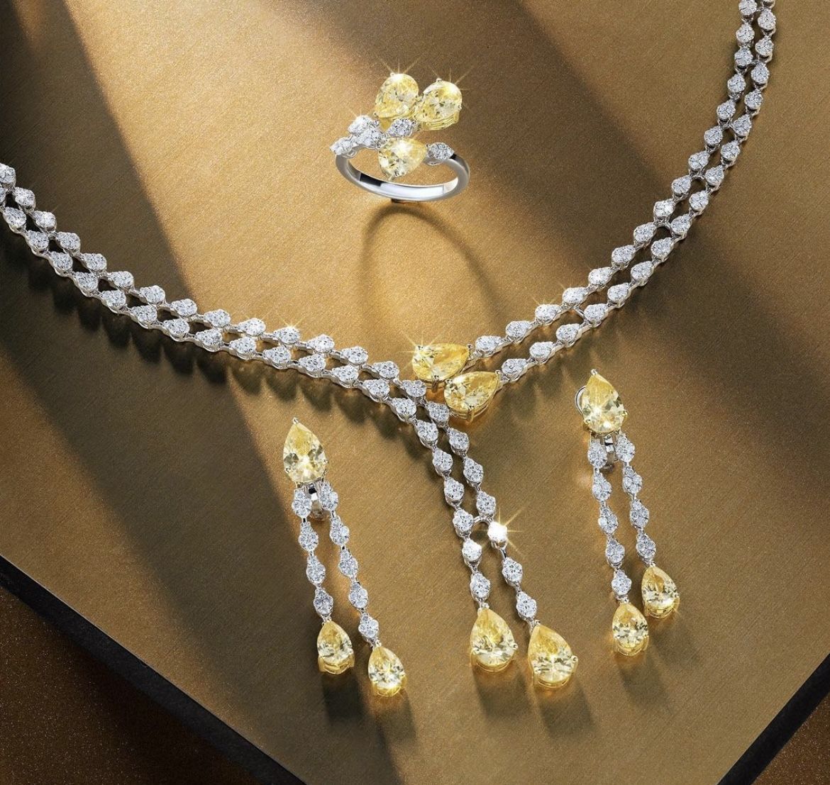 a necklace with matching earrings shown together