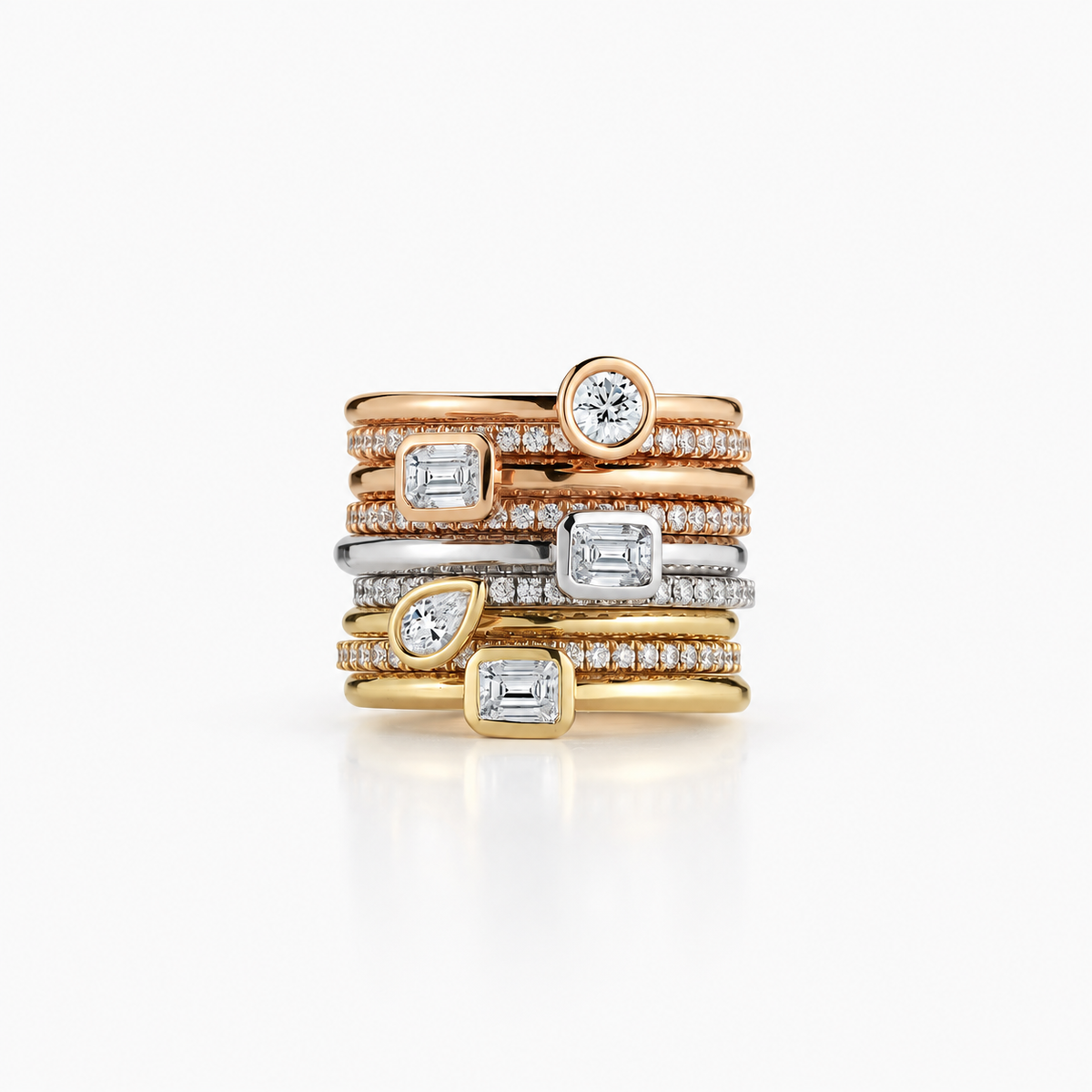 Slim bands in contrasting tones combine round, pear-shaped and rectangular clear accents with sparkling rows.