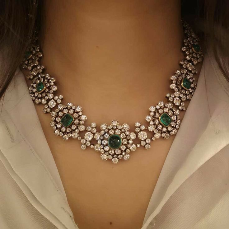 necklaces with green-toned details arranged in a floral pattern