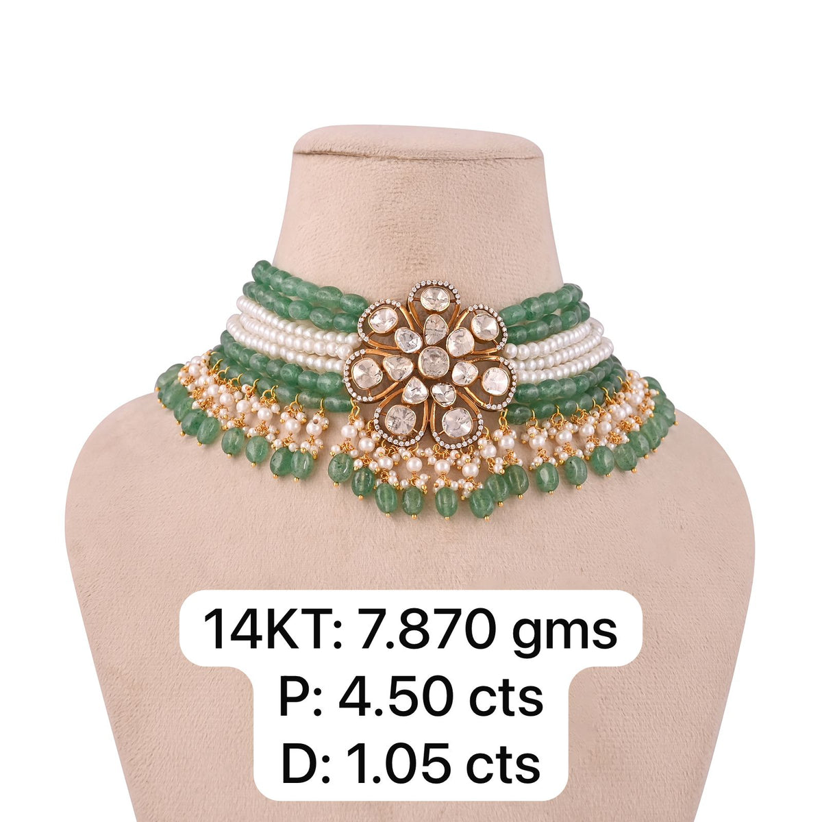 a close-fitting collar with green and pale round accents